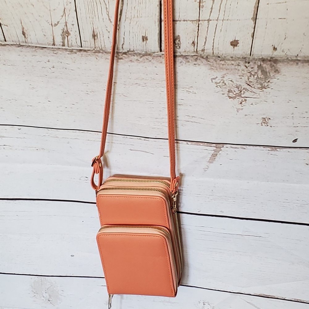 Malibu Skye women's vinyl crossbody bag with three zippered compartments peach